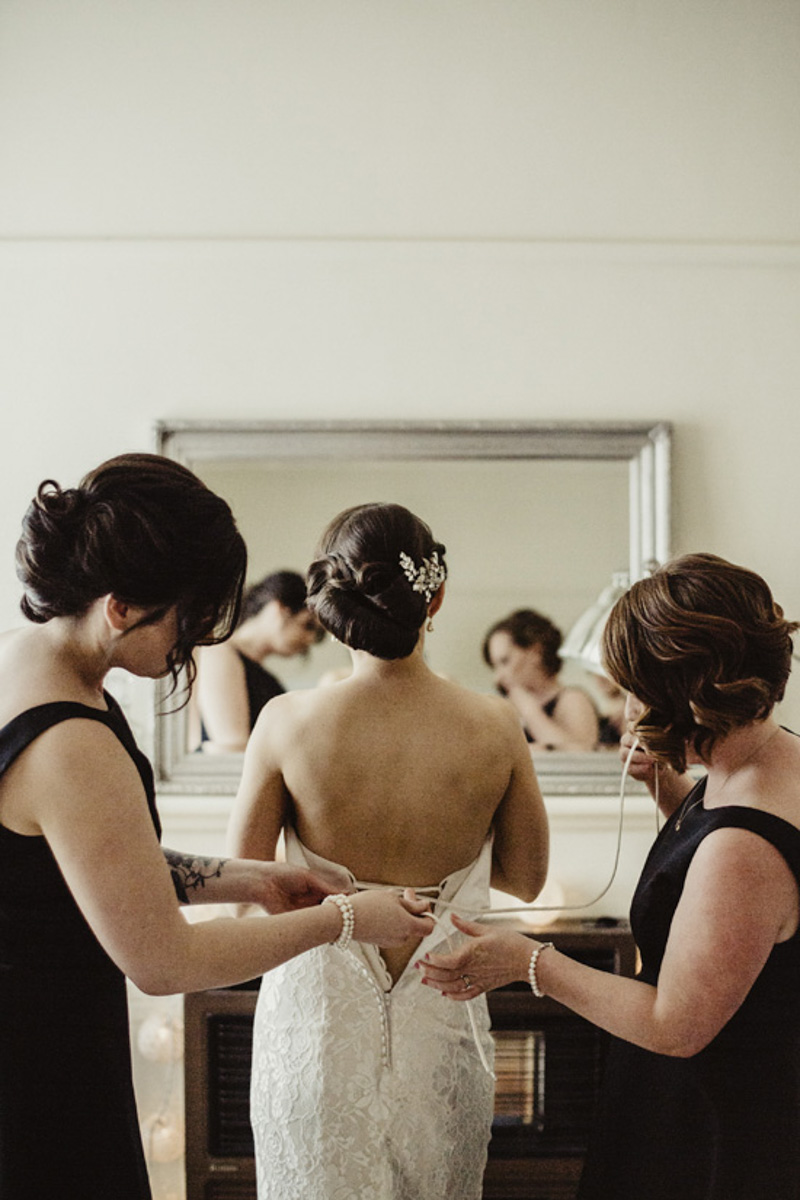 bride getting ready photo with bridesmaids
