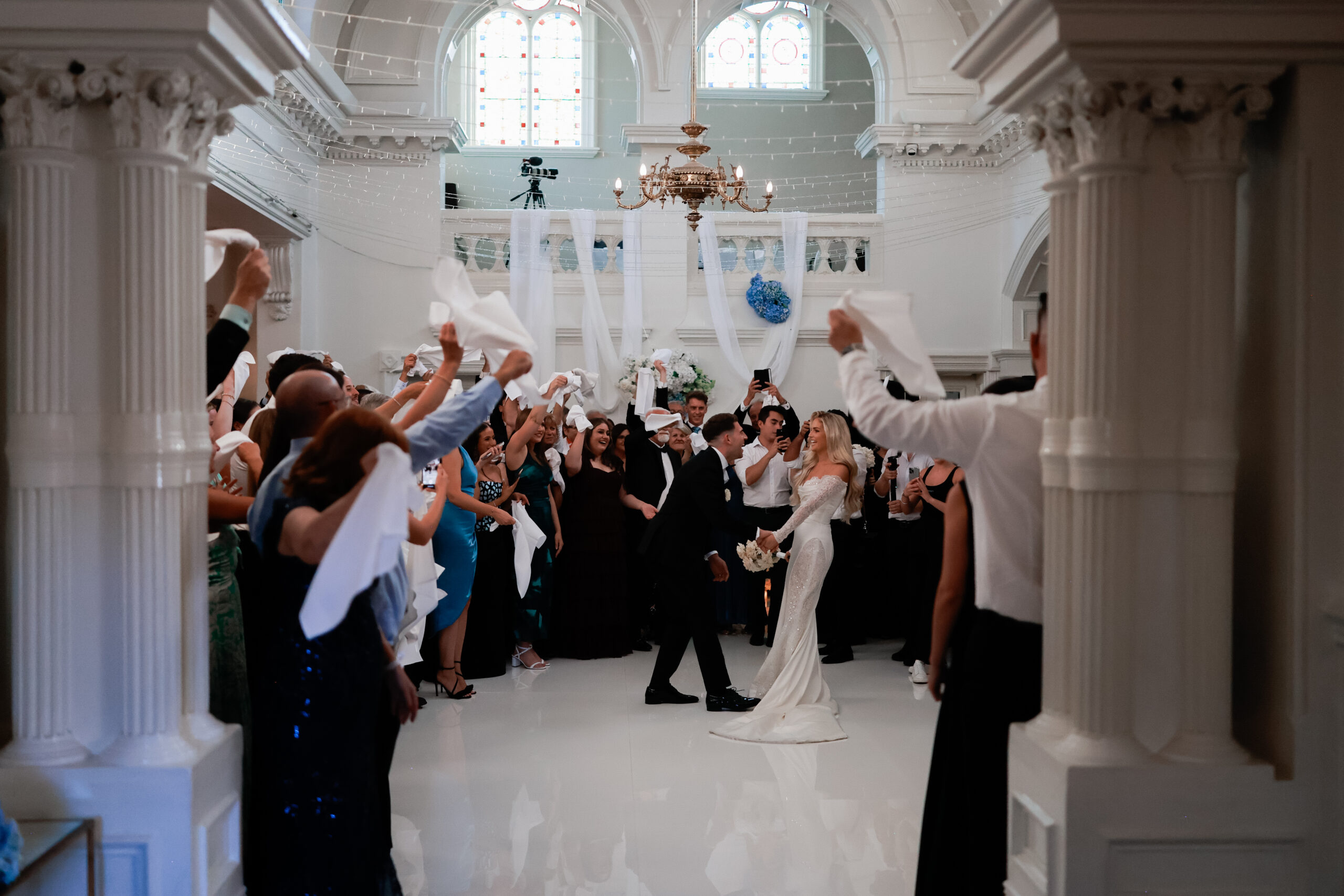 Bride and groom dancing at their wedding surrounded by guests. Melborune Wedding