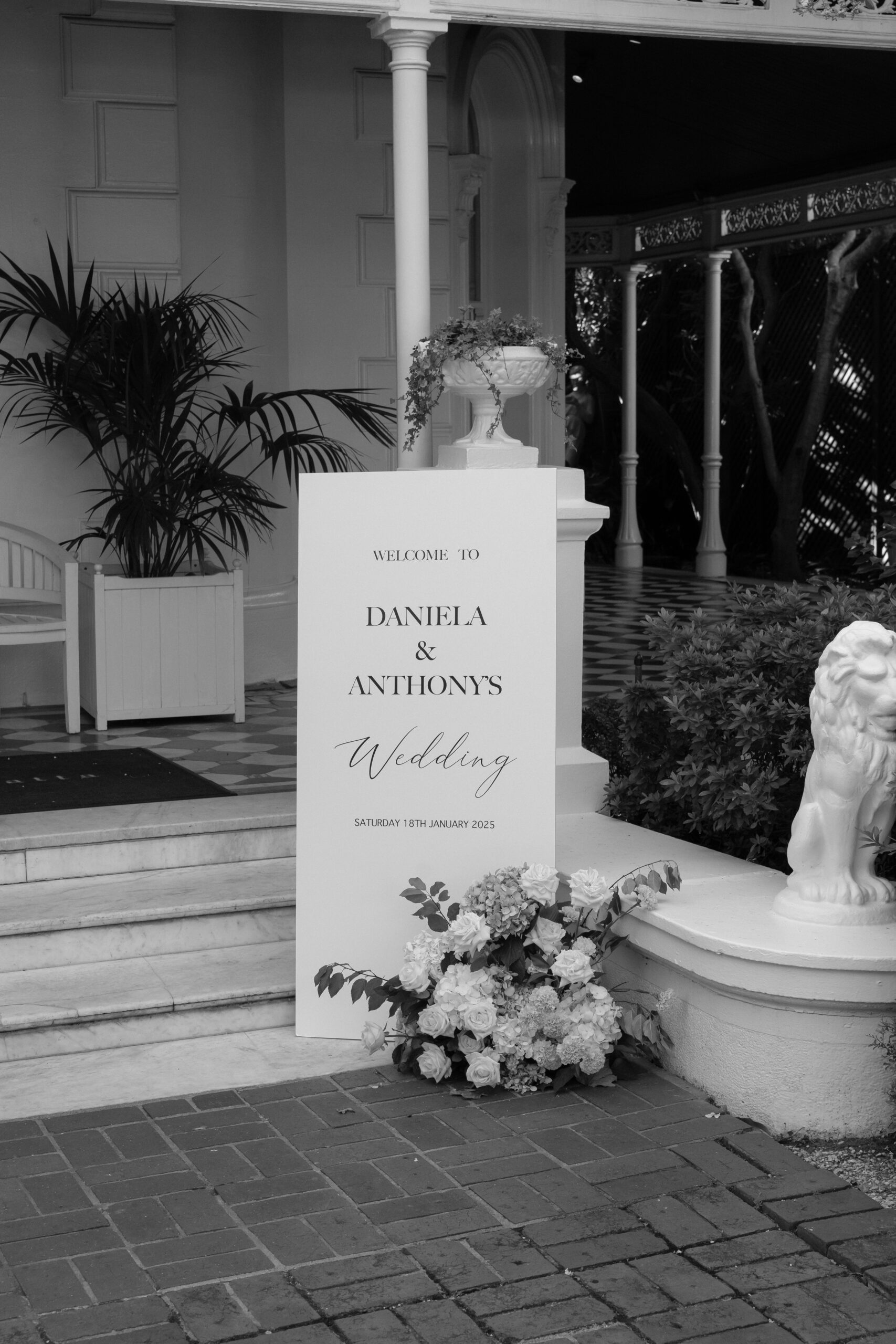 Wedding venue styling. Welcome board and floral arrangements.