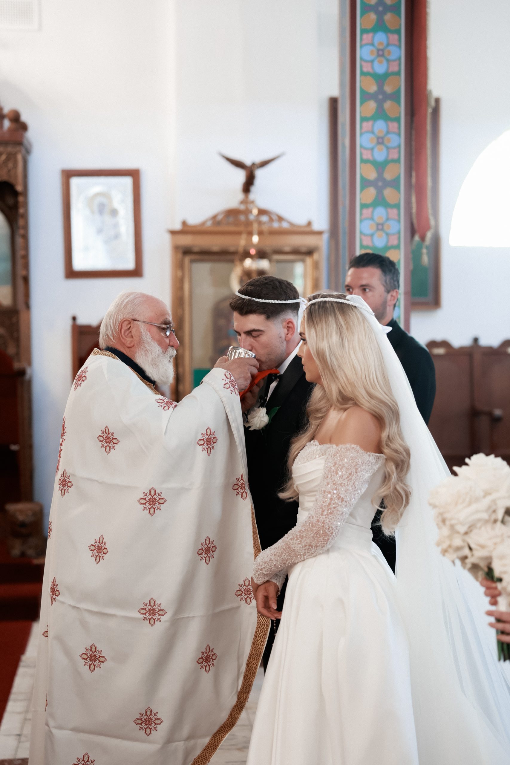 Bride and groom during their orthodox wedding ceremony