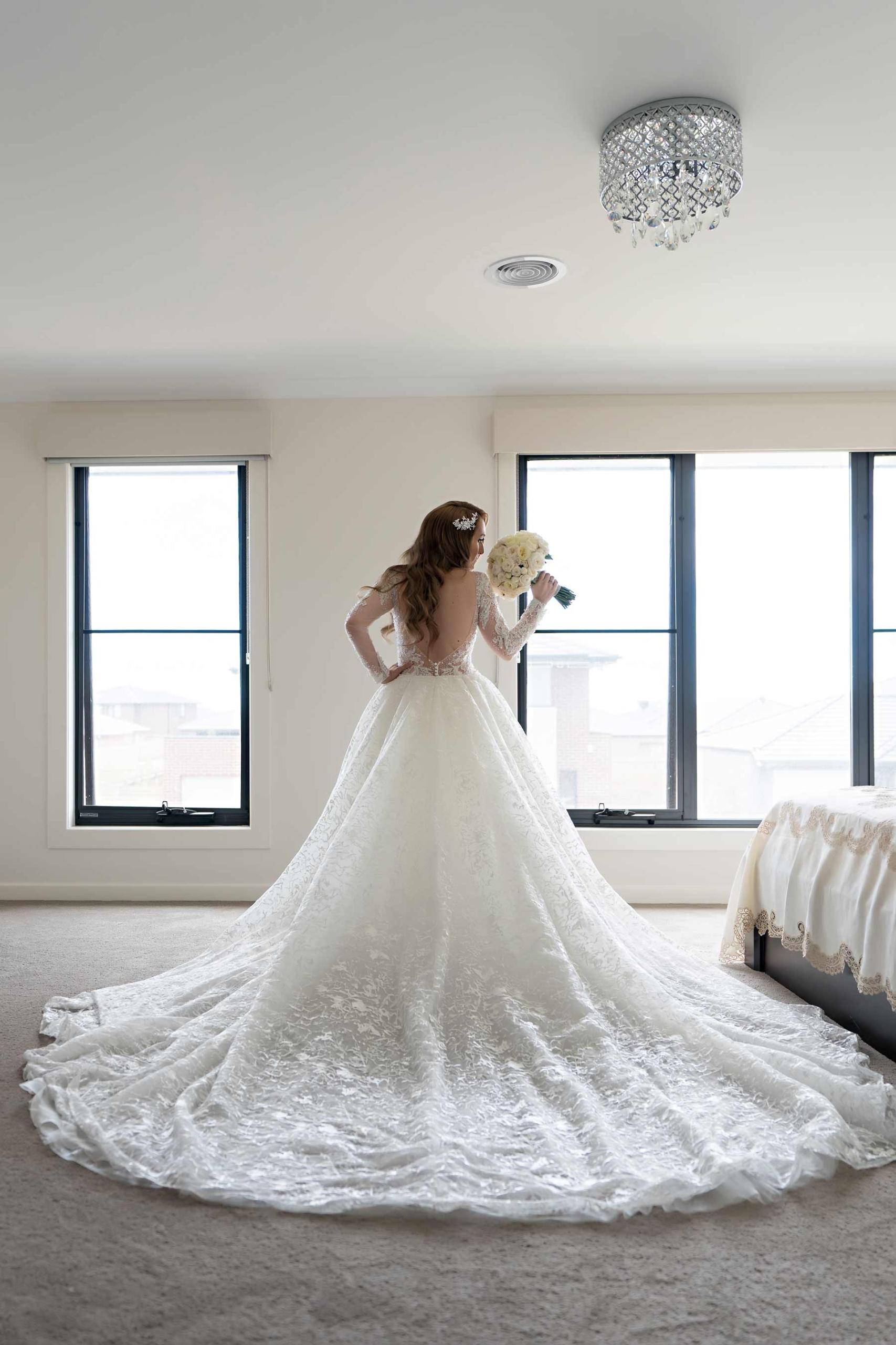 Melina + Vuong RC Real Bride Wearing Demetrios Platinum Wedding dress in 'Analisa' 