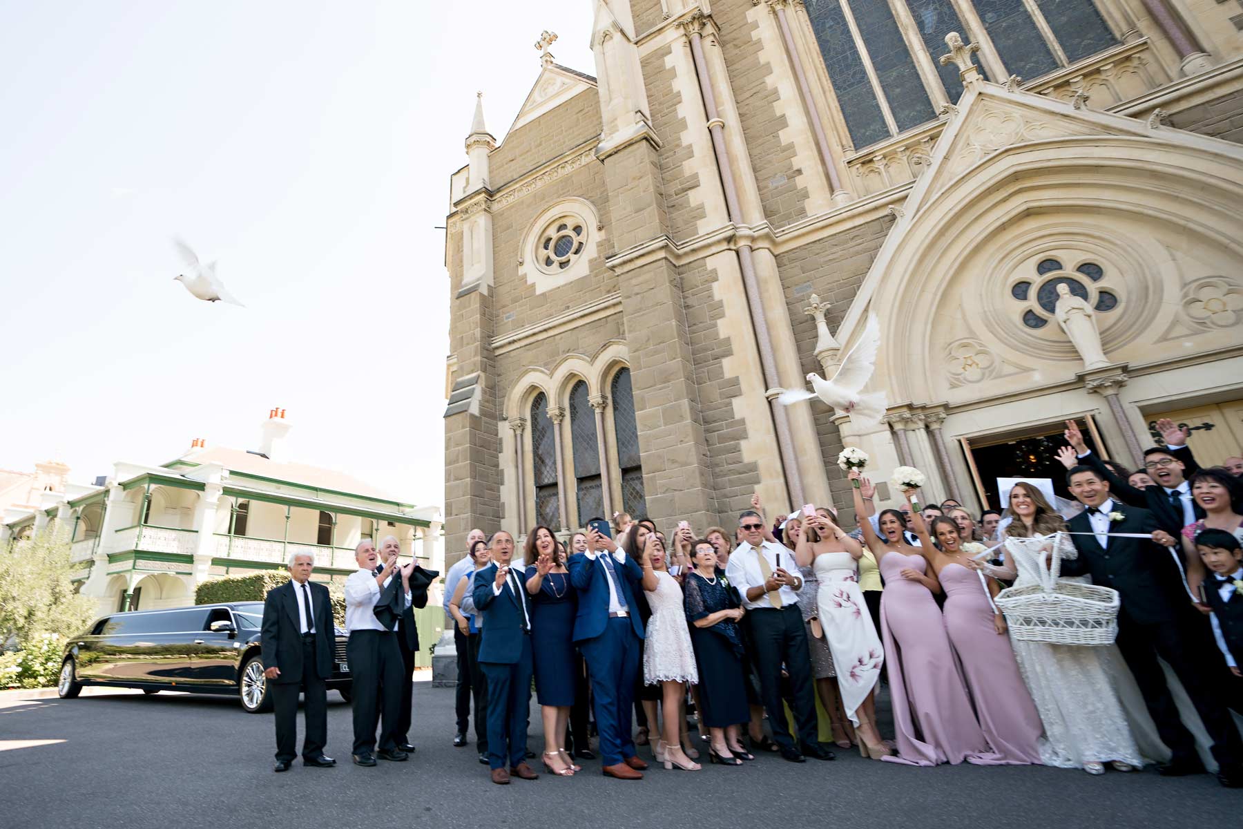 Melina + Vuong RC Real Bride Wearing Demetrios Platinum Wedding dress in 'Analisa' 