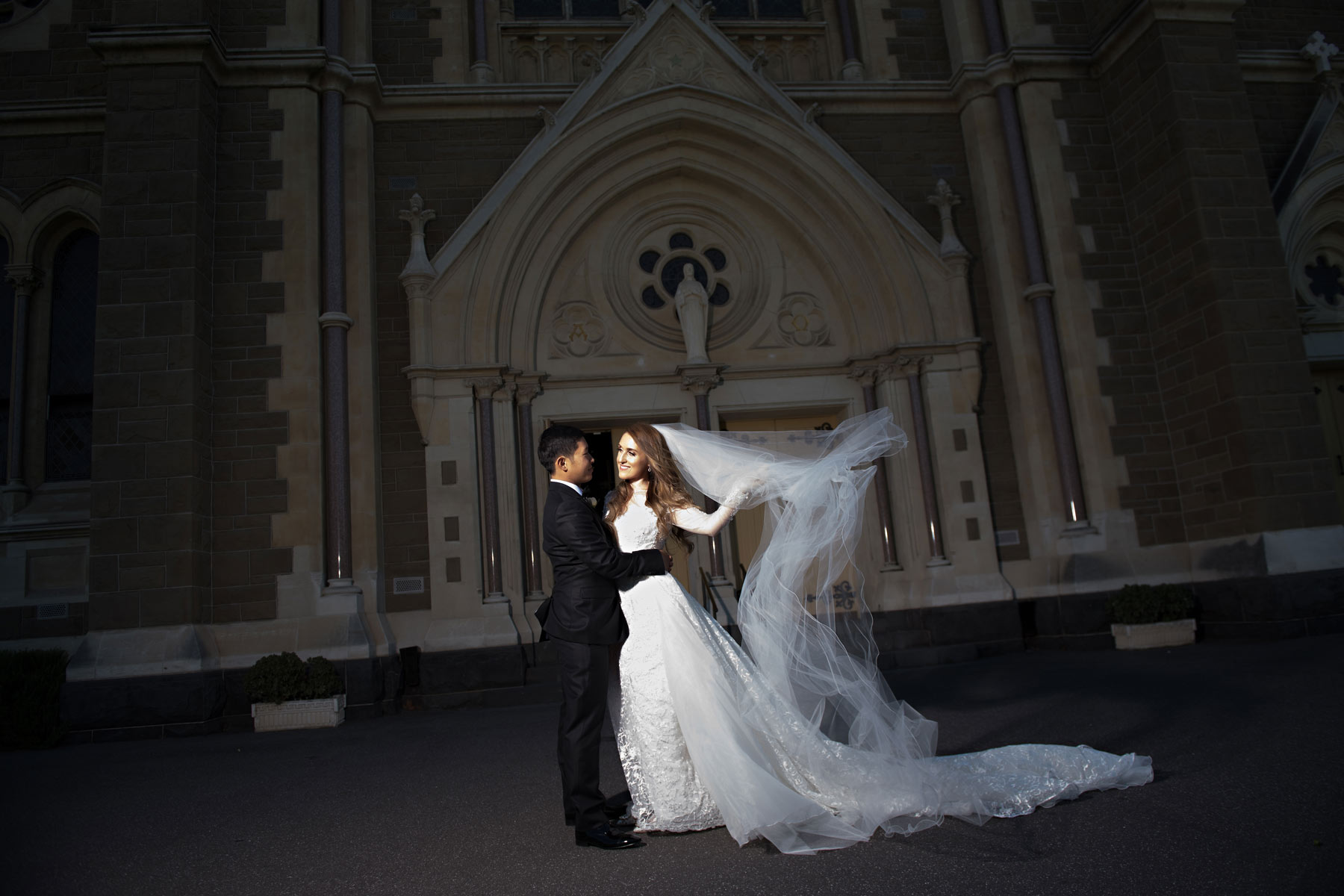 Melina + Vuong RC Real Bride Wearing Demetrios Platinum Wedding dress in 'Analisa'