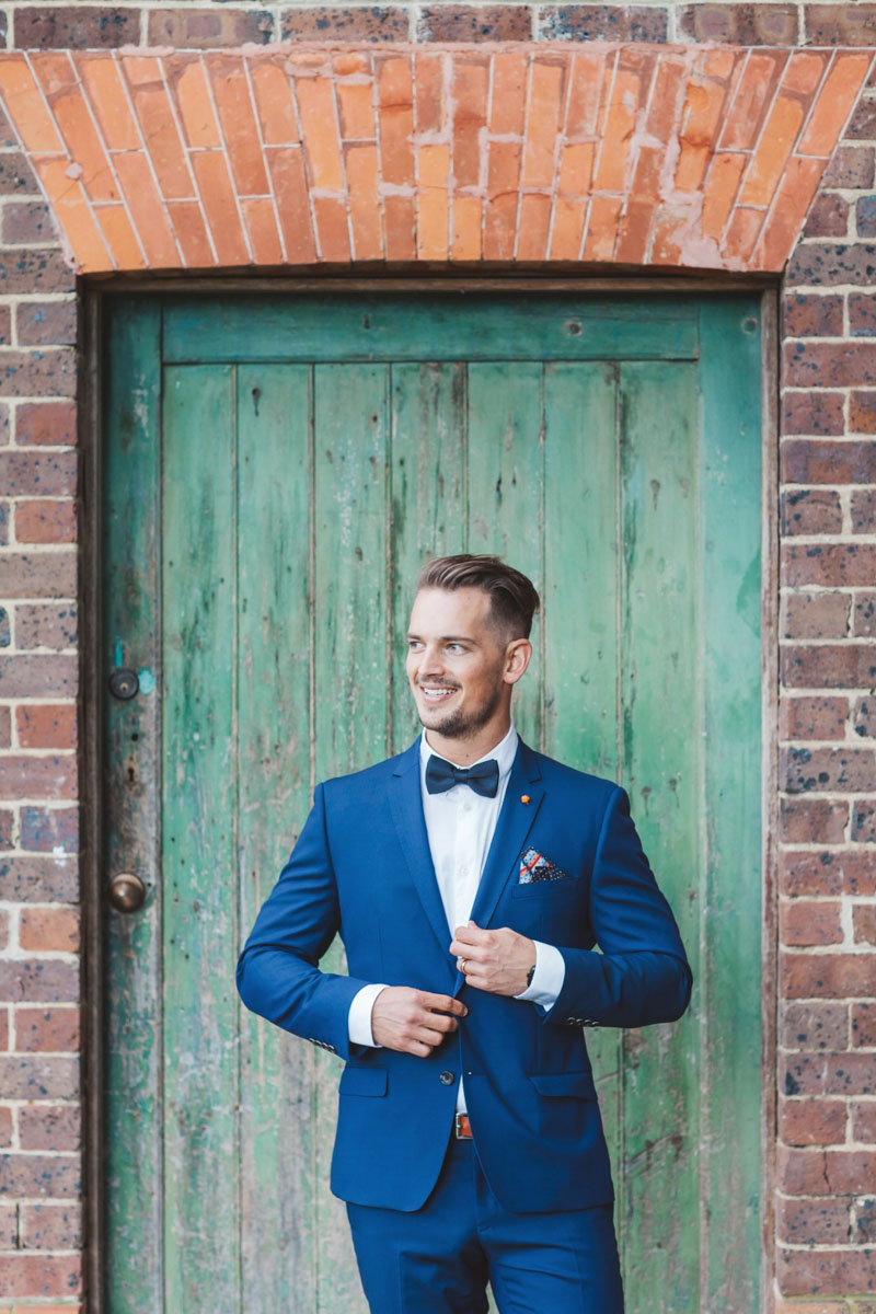 Blue Suit Real Bride Isabelle marries in Demetrios Platinum 330 wedding dress at Stones of the Yarra Valley