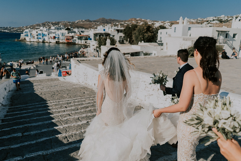 bride walking with bridesmaids photo