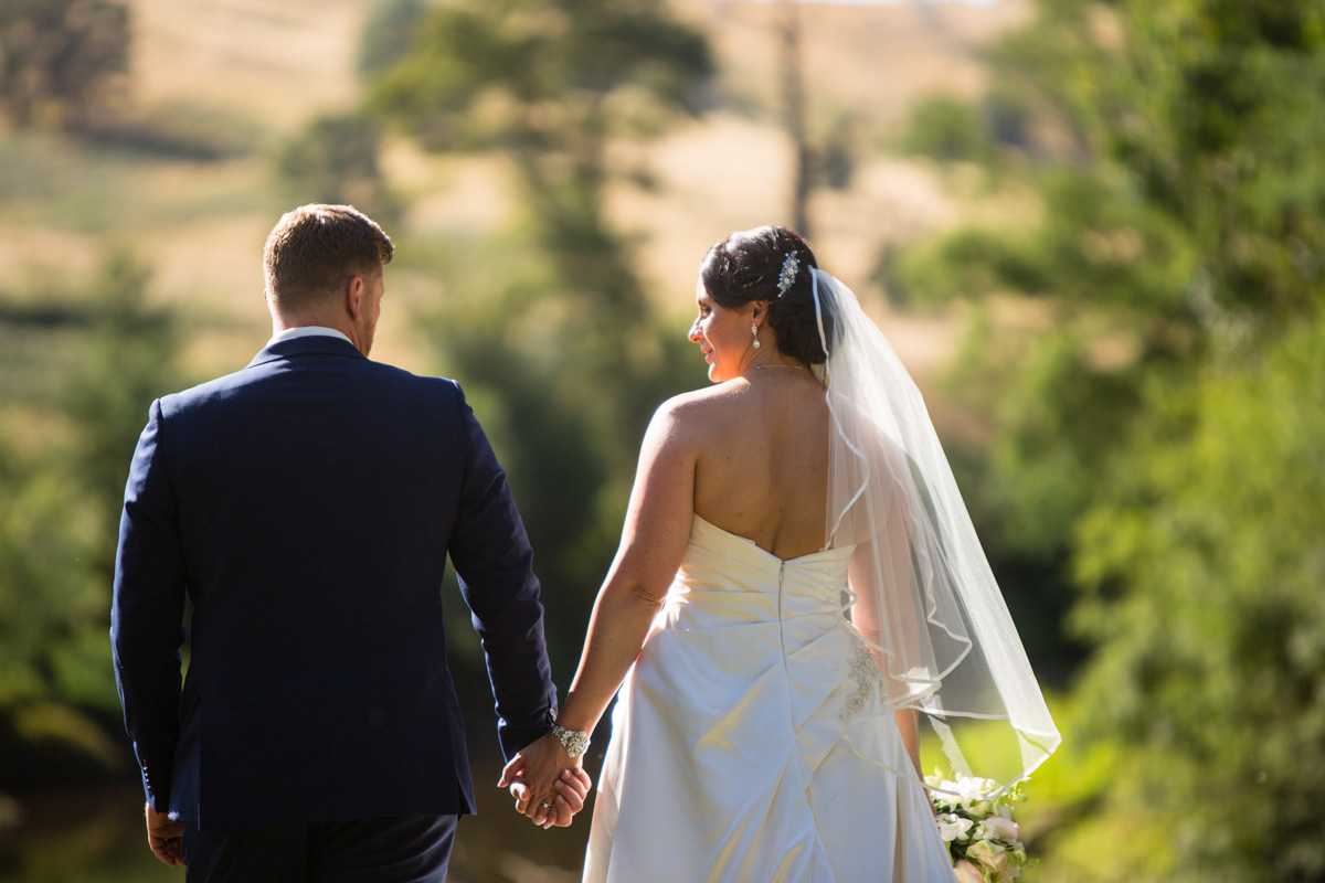 Bride and groom walking away 