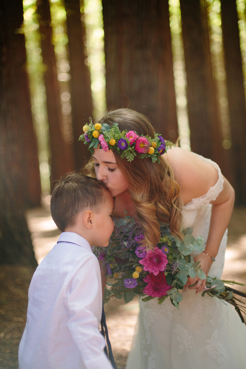 Real Bride Sam wore a stunning bohemian wedding dress from Raffaele Ciuca with a bright floral flower crown for her forest wedding.