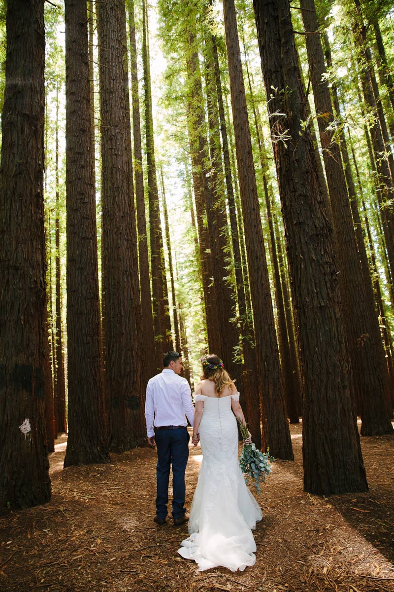 Real Bride Sam wore a stunning bohemian wedding dress from Raffaele Ciuca with a bright floral flower crown for her forest wedding.