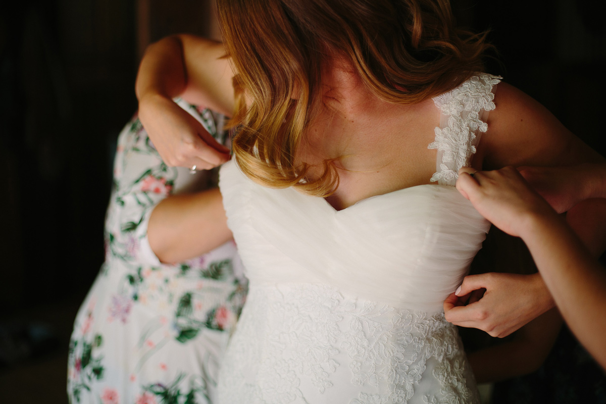 Real Bride Sam wore a stunning bohemian wedding dress from Raffaele Ciuca with a bright floral flower crown for her forest wedding.