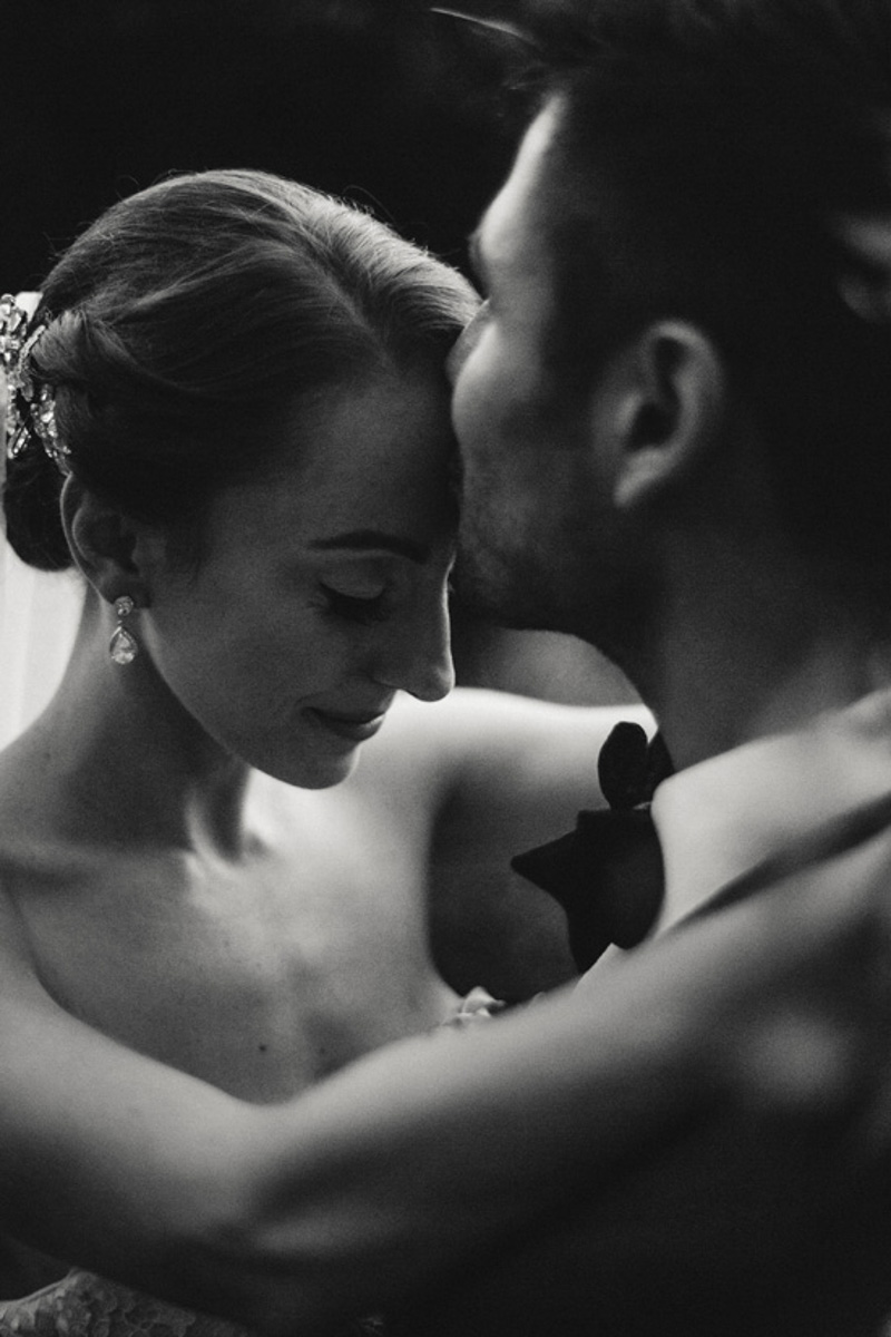 black and white wedding photo bride and groom dancing