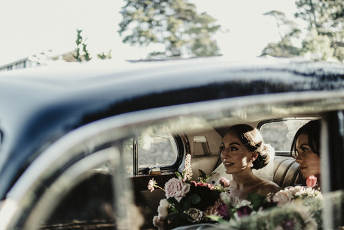 bride in the car photo native bouquet