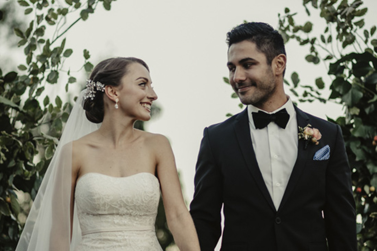 bride and groom looking at each other photo