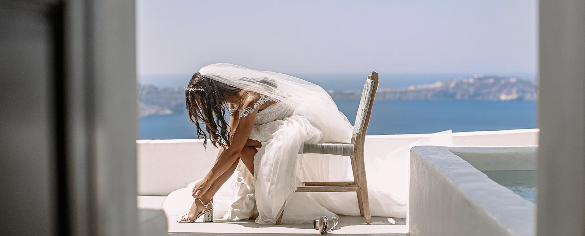 real bride wears Pronovias wedding dress for destination wedding in Santorini Greece