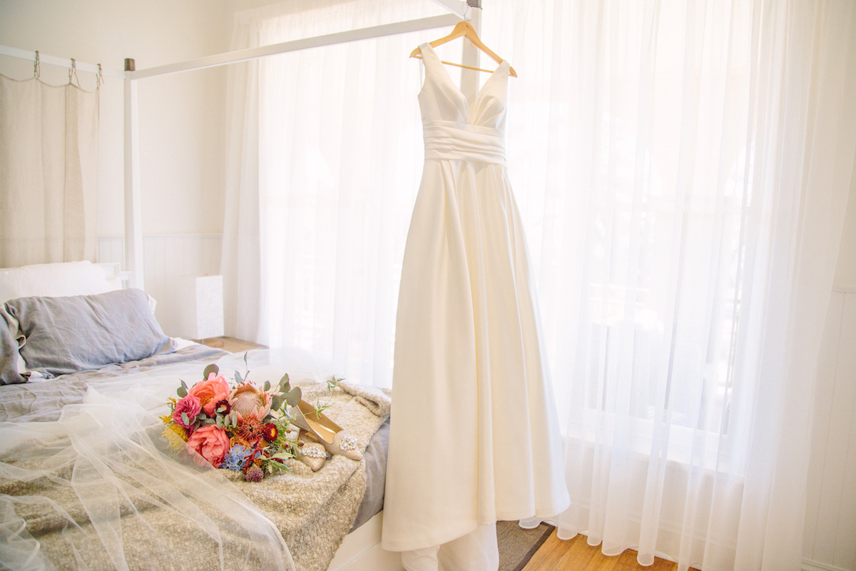 Raffaele Ciuca Real Bride Jessica married Jarrod in a satin, v-neck, a-line ball gown from Raffaele Ciuca Bridal for her winery wedding. Photography by Perla. Melbourne, Australia