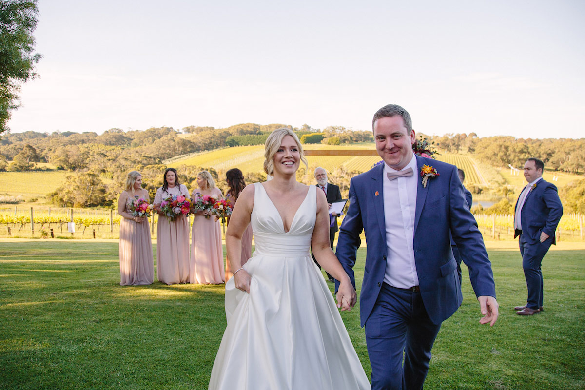 Raffaele Ciuca Real Bride Jessica married Jarrod in a satin, v-neck, a-line ball gown from Raffaele Ciuca Bridal for her winery wedding. Photography by Perla. Melbourne, Australia